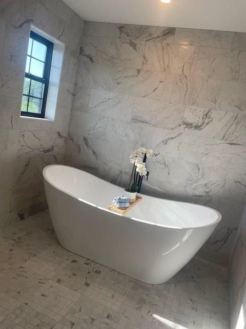 1360 Lexington Ontario Rd, Mansfield, OH 44904 - bathroom featuring tile walls and a freestanding bath