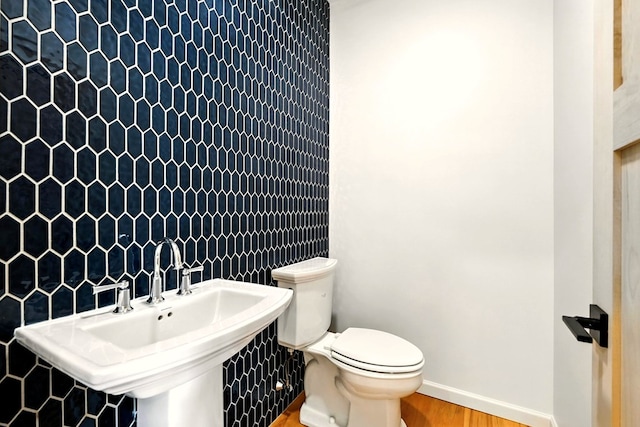 1360 Lexington Ontario Rd, Mansfield, OH 44904 - half bath featuring a sink and wood finished floors