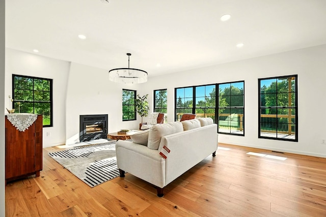 1360 Lexington Ontario Rd, Mansfield, OH 44904 - living room featuring light wood-style flooring, recessed lighting, and a fireplace with flush hearth