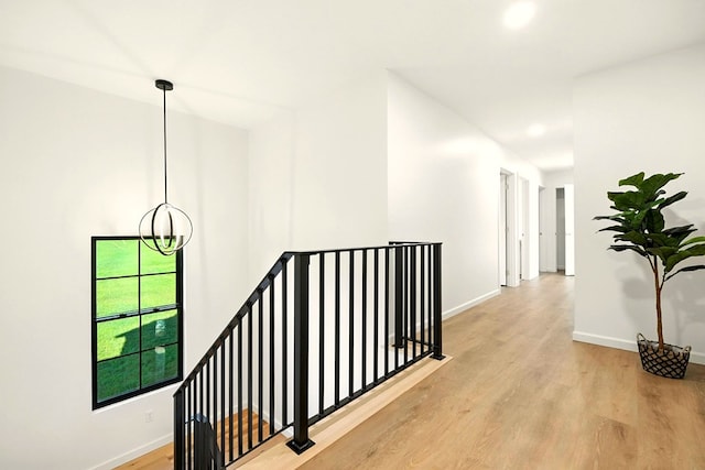 1360 Lexington Ontario Rd, Mansfield, OH 44904 - hall featuring an upstairs landing and wood finished floors