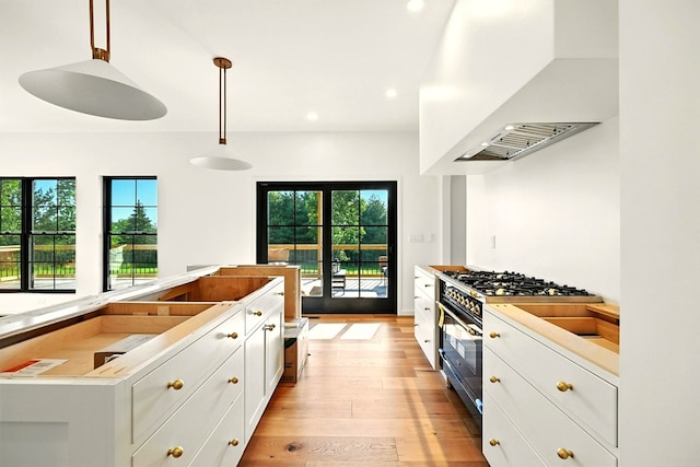 1360 Lexington Ontario Rd, Mansfield, OH 44904 - kitchen with premium range hood, gas stove, light wood-style floors, white cabinetry, and recessed lighting