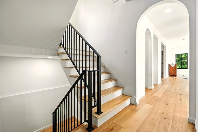 1360 Lexington Ontario Rd, Mansfield, OH 44904 - stairway with arched walkways and wood finished floors