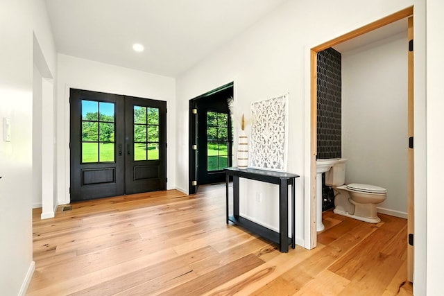 1360 Lexington Ontario Rd, Mansfield, OH 44904 - entrance foyer with light wood-style flooring, french doors, and recessed lighting
