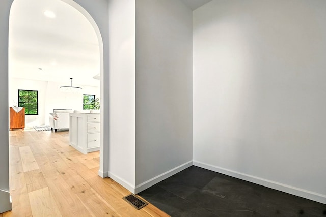 1360 Lexington Ontario Rd, Mansfield, OH 44904 - hallway featuring arched walkways and light wood finished floors