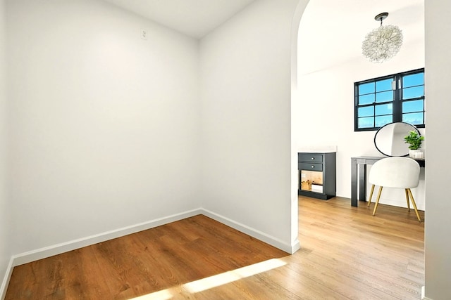 1360 Lexington Ontario Rd, Mansfield, OH 44904 - unfurnished room featuring light wood-style flooring and arched walkways