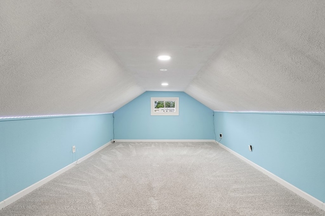 519 Park Ave, Galion, OH 44833 - bonus room with a textured ceiling, carpet flooring, and lofted ceiling