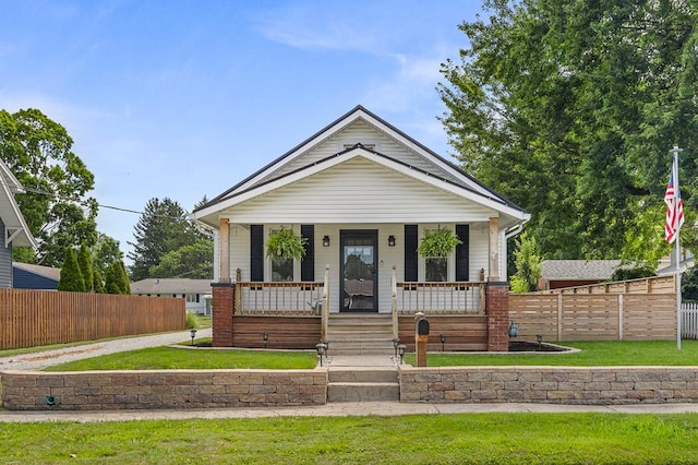 519 Park Ave, Galion, OH 44833 - view of front of house with covered porch and a fenced front yard