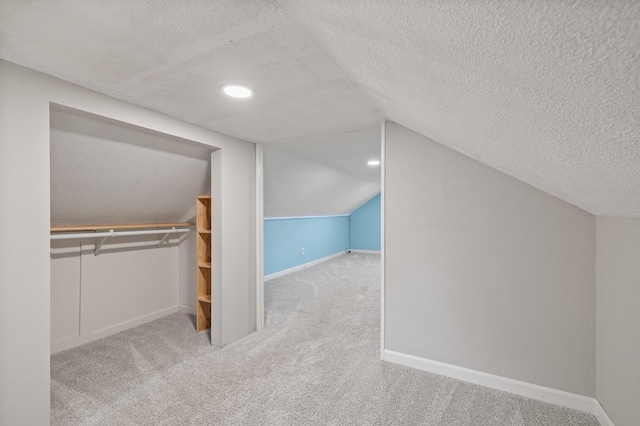 519 Park Ave, Galion, OH 44833 - bonus room with a textured ceiling, carpet, and vaulted ceiling