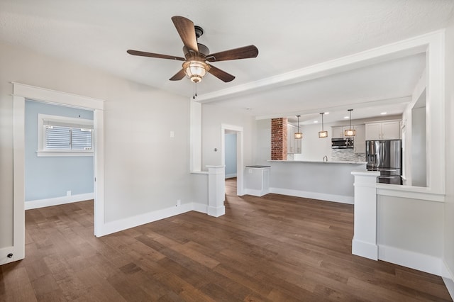 519 Park Ave, Galion, OH 44833 - unfurnished living room with ceiling fan and dark wood-type flooring