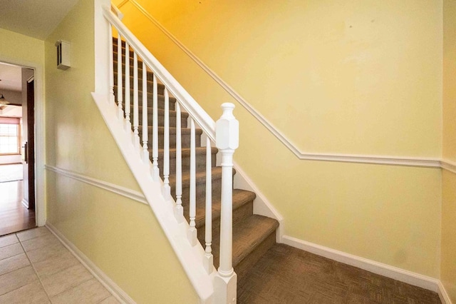 452 Pleasant Ln, Bucyrus, OH 44820 - staircase featuring baseboards and tile patterned floors