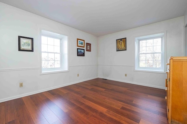 452 Pleasant Ln, Bucyrus, OH 44820 - empty room featuring plenty of natural light, baseboards, and wood finished floors