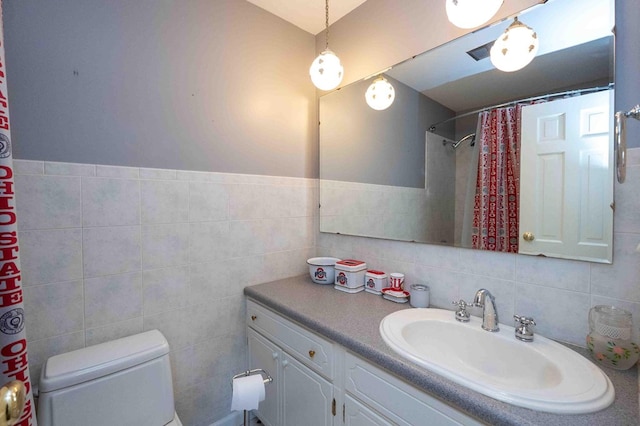 452 Pleasant Ln, Bucyrus, OH 44820 - bathroom with tile walls, toilet, and vanity