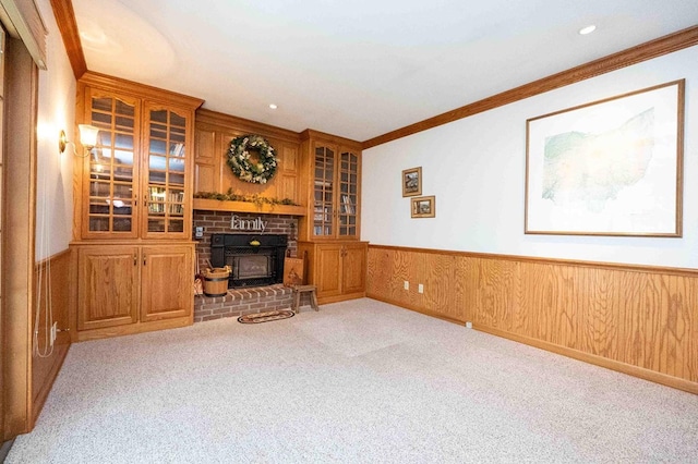 452 Pleasant Ln, Bucyrus, OH 44820 - unfurnished living room with recessed lighting, a wainscoted wall, crown molding, a fireplace, and carpet flooring