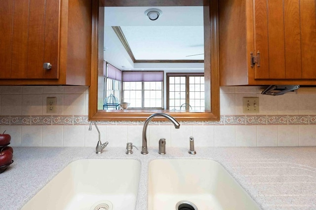 452 Pleasant Ln, Bucyrus, OH 44820 - room details featuring brown cabinetry, a sink, and light countertops