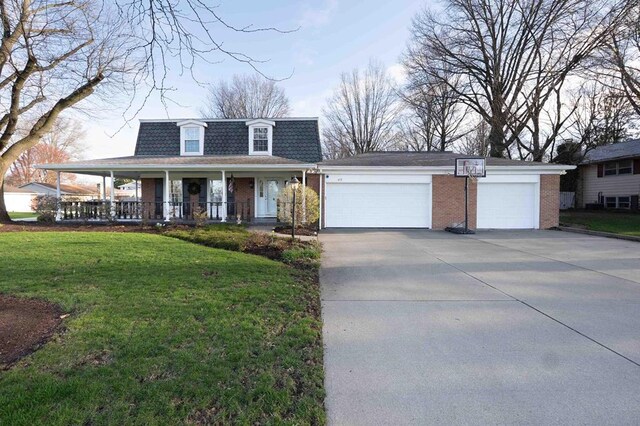 452 Pleasant Ln, Bucyrus, OH 44820 - front facade with a shingled roof, covered porch, a front lawn, and brick siding