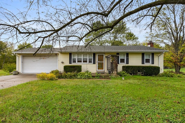 ranch-style house featuring a garage and a front lawn