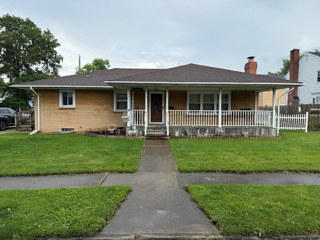 1022 S E E, Bucyrus, OH 44820 - view of front of property with covered porch, a chimney, and brick siding