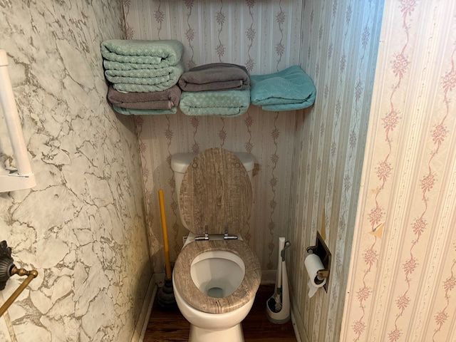 1022 S E E, Bucyrus, OH 44820 - bathroom featuring wood finished floors and wallpapered walls