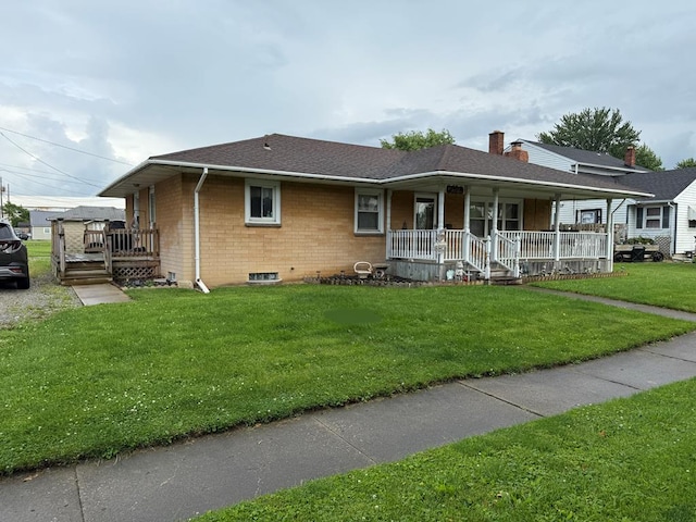 1022 S E E, Bucyrus, OH 44820 - ranch-style home with covered porch, brick siding, a front yard, roof with shingles, and a chimney
