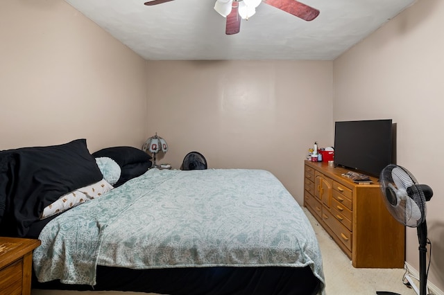 bedroom with ceiling fan and light colored carpet