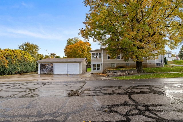 view of front of property with an outbuilding and a garage