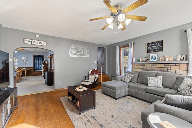 living room with ceiling fan and wood-type flooring