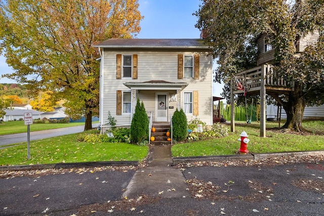 view of front of property with a front lawn