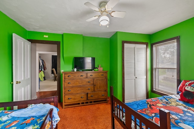 bedroom featuring carpet, a closet, and ceiling fan