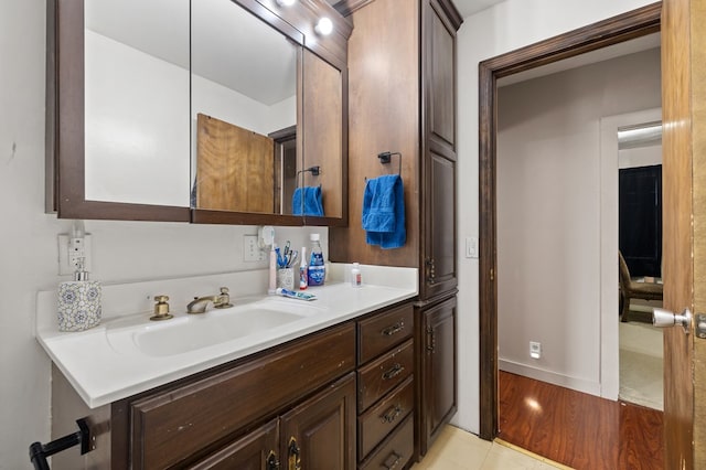 bathroom with tile patterned flooring and vanity