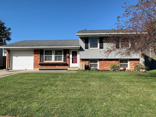 split level home featuring a front lawn and a garage