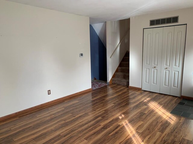 1149 Robinhood Dr, Bucyrus, OH 44820 - unfurnished bedroom with wood finished floors and a closet