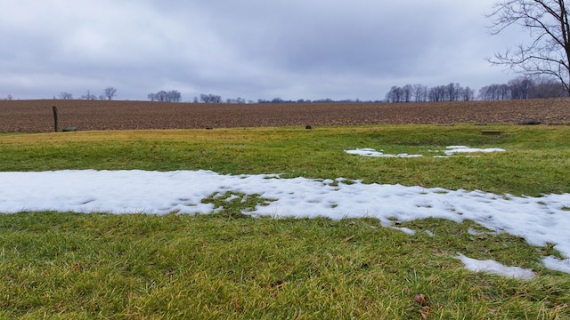view of yard with a rural view