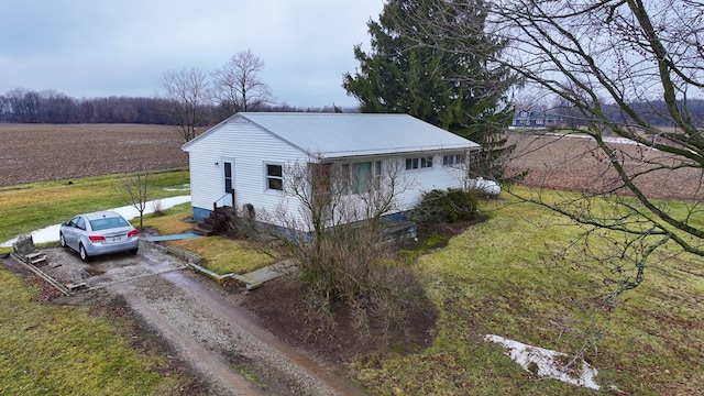 view of property exterior with a lawn