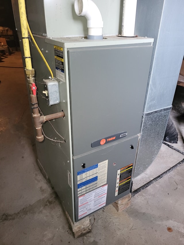 utility room with heating unit