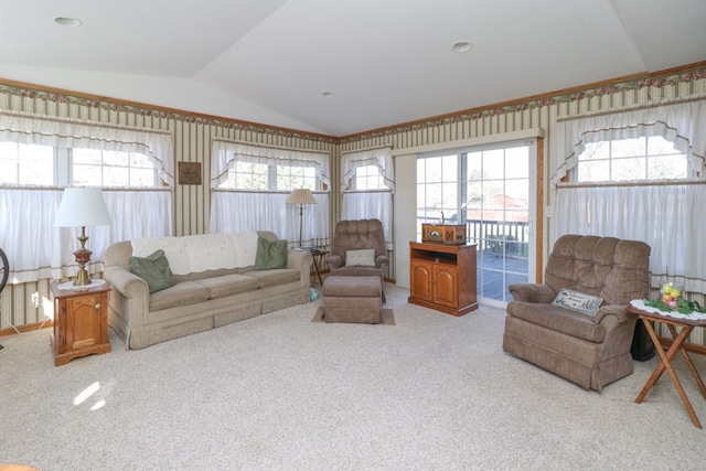 living room with carpet and vaulted ceiling