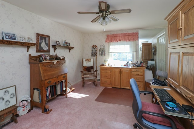 office space with wallpapered walls, light colored carpet, and ceiling fan