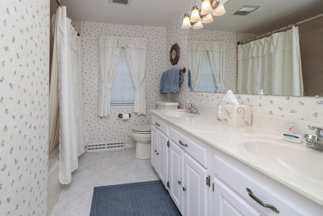 bathroom with toilet, wallpapered walls, and a sink