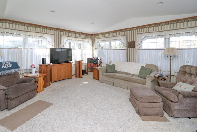 living room with light colored carpet and vaulted ceiling