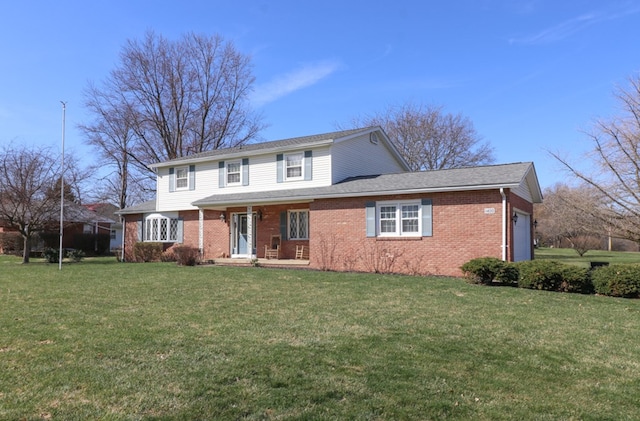 traditional-style house featuring a garage, brick siding, a front yard, and a shingled roof