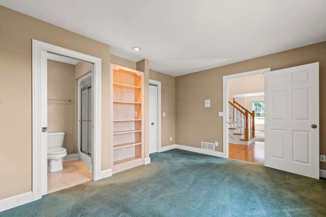 unfurnished bedroom with connected bathroom, carpet, baseboards, visible vents, and recessed lighting