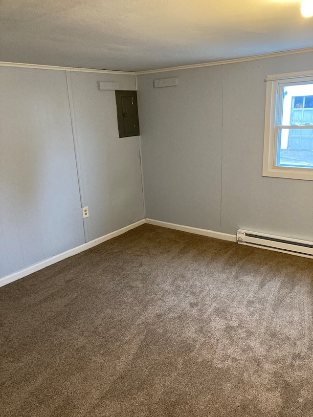 spare room featuring crown molding, a baseboard radiator, electric panel, and carpet floors