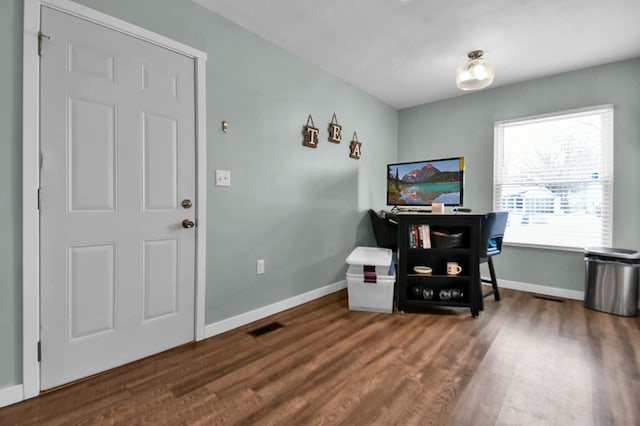 office with dark hardwood / wood-style floors