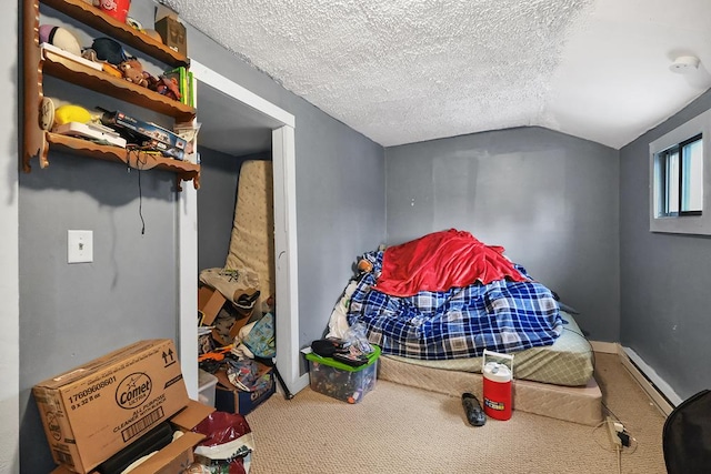 bedroom featuring lofted ceiling, baseboards, a textured ceiling, and carpet