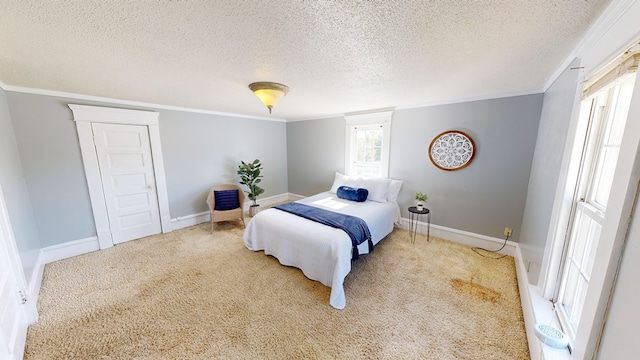 bedroom featuring a textured ceiling and ornamental molding