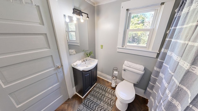 bathroom featuring crown molding, vanity, and toilet