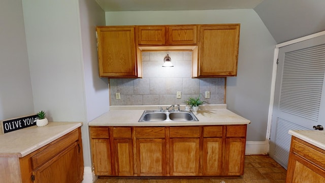 kitchen featuring backsplash and sink