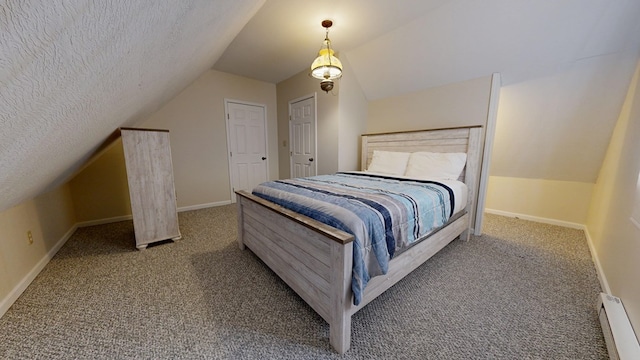 bedroom with carpet floors, baseboards, baseboard heating, and a textured ceiling