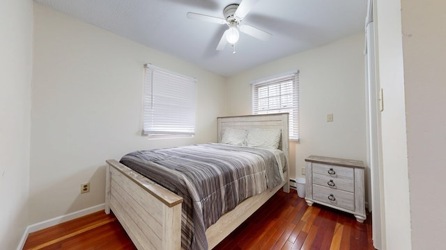 bedroom with ceiling fan, baseboards, and dark wood finished floors