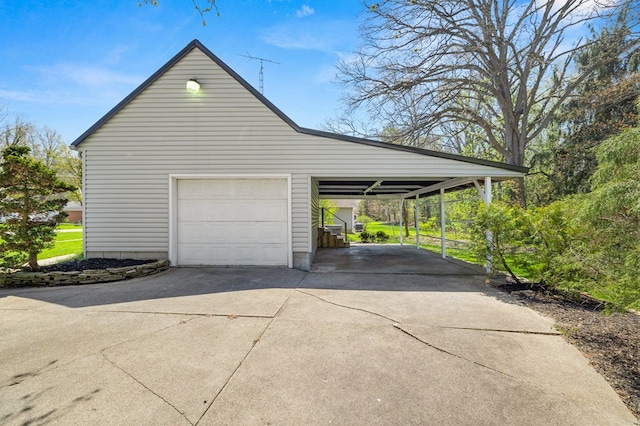 garage featuring a garage and driveway