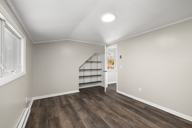 additional living space with lofted ceiling, a baseboard radiator, wood finished floors, and baseboards